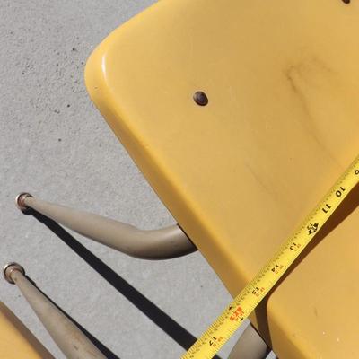 2 yellow school-aged chairs