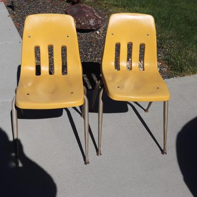 2 yellow school-aged chairs