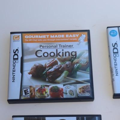 Pink Nintendo DS with games