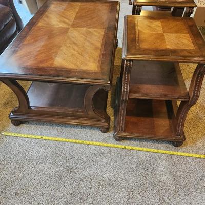 Brown furniture coffee table and two end tables.