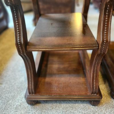Brown furniture coffee table and two end tables.