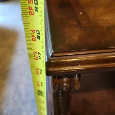 Brown furniture coffee table and two end tables.