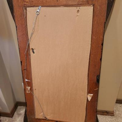 Vintage door that's been turned into a hall mirror
