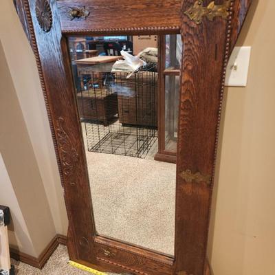 Vintage door that's been turned into a hall mirror