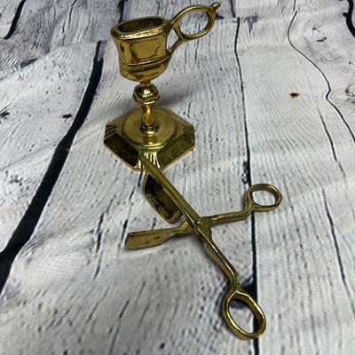Antique candles, snuffer, and holder.