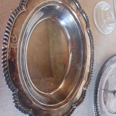 SILVER PLATED SERVING PIECES AND A GLASS CAKE PLATE