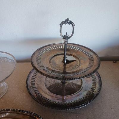 SILVER PLATED SERVING PIECES AND A GLASS CAKE PLATE