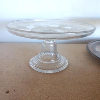SILVER PLATED SERVING PIECES AND A GLASS CAKE PLATE