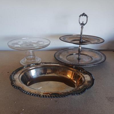 SILVER PLATED SERVING PIECES AND A GLASS CAKE PLATE