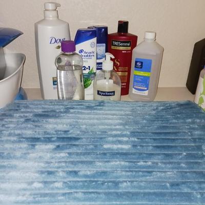 2 THICK BATH RUGS AND SOME TOILETRIES