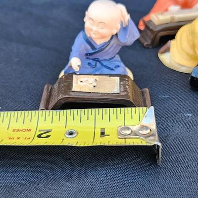 4 vtg MINIATURE ORIENTAL STATUES OF BUDDIST MONK CHILDren playing RESIN