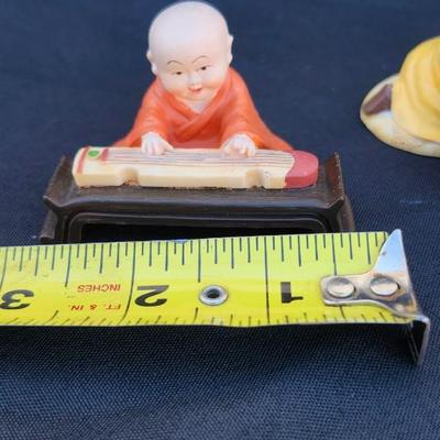 4 vtg MINIATURE ORIENTAL STATUES OF BUDDIST MONK CHILDren playing RESIN