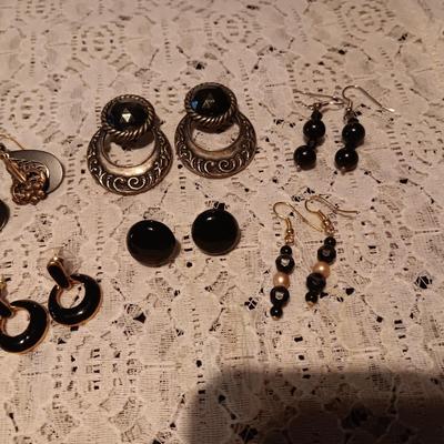 BLACK AND SILVER-TONE PIERCED EARRINGS
