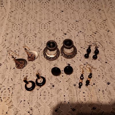 BLACK AND SILVER-TONE PIERCED EARRINGS