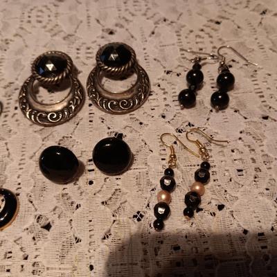 BLACK AND SILVER-TONE PIERCED EARRINGS