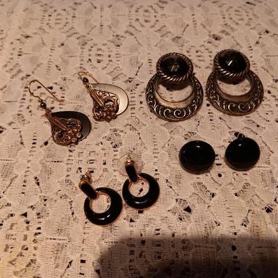 BLACK AND SILVER-TONE PIERCED EARRINGS
