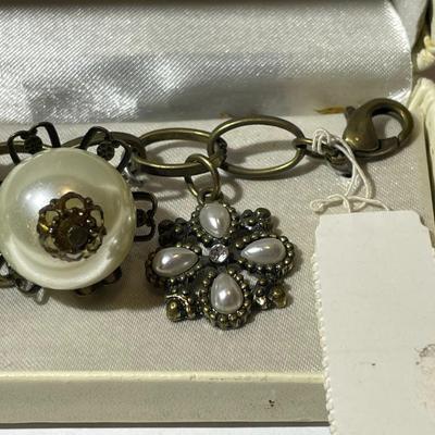 Vintage Mid-Century Antiqued Brass Charm Bracelet by Decade with Miscellaneous Charms as Pictured.