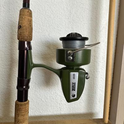 2 FISHING POLES W/REELS, 2 POLE TUBES AND A NYLON BAG