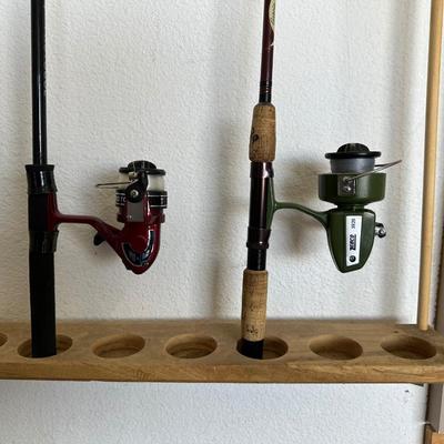 2 FISHING POLES W/REELS, 2 POLE TUBES AND A NYLON BAG