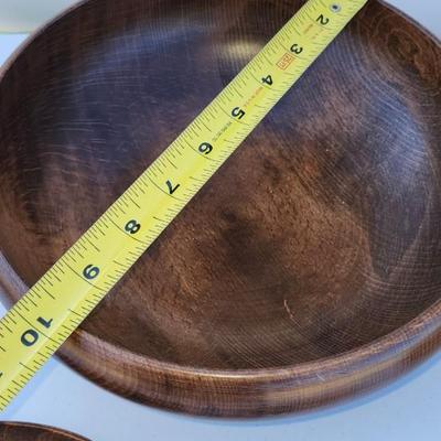 Wooden bowl with 4 salad bowls and fork and spoon