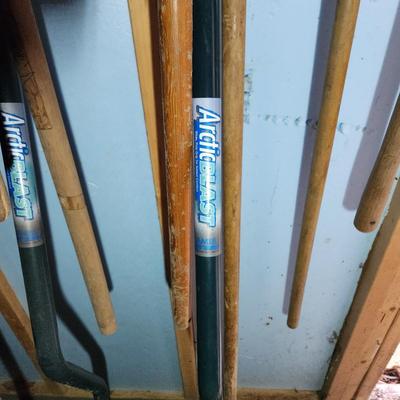 Wall of Garden Yard Tools Shovels, Racks, Small hand Tools in bucket with seat, Snow Shovels