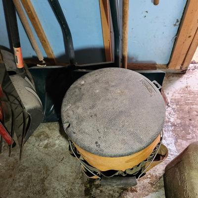 Wall of Garden Yard Tools Shovels, Racks, Small hand Tools in bucket with seat, Snow Shovels