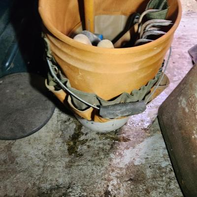 Wall of Garden Yard Tools Shovels, Racks, Small hand Tools in bucket with seat, Snow Shovels