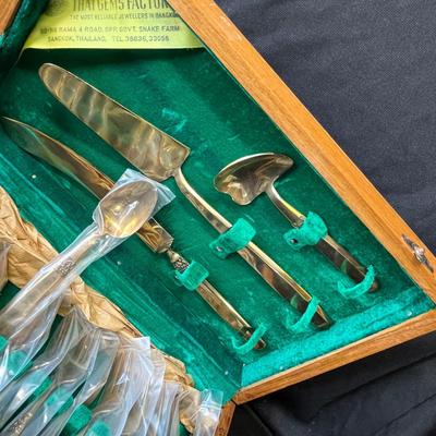 Lot 235 Brass flatware set