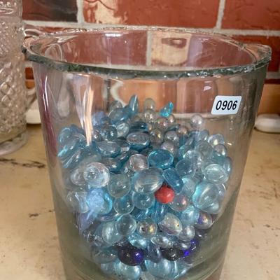 Glass vase full of glass beads