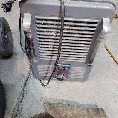 Garage creeping seat, vintage working space heater, mittens and bike chains
