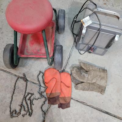 Garage creeping seat, vintage working space heater, mittens and bike chains