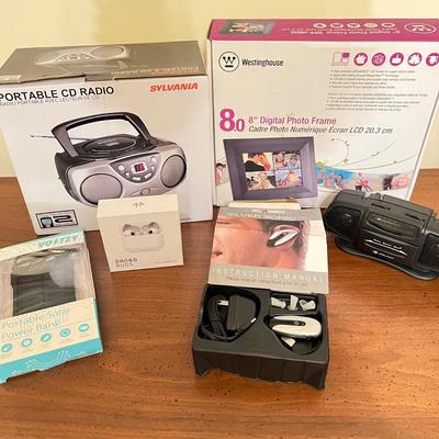 Electronics Lot - CD Radio, Ear Buds, Digital Frame, Power Bank