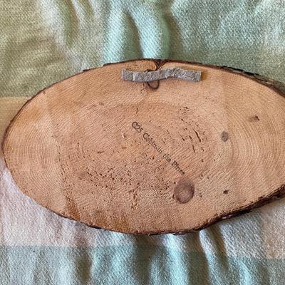 Cabin scene on wood piece