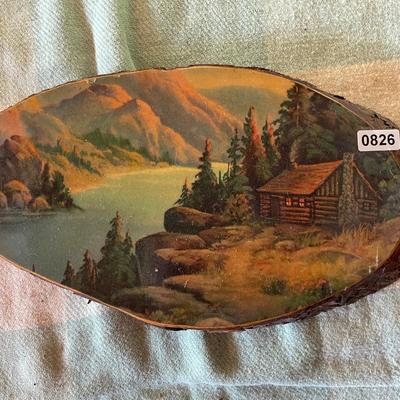Cabin scene on wood piece