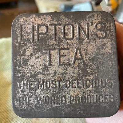 Lipton tea tin full of thread