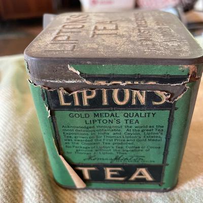 Lipton tea tin full of thread