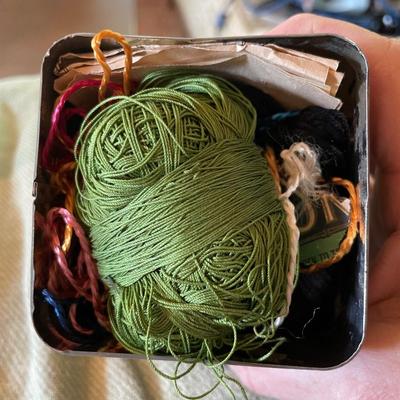 Lipton tea tin full of thread