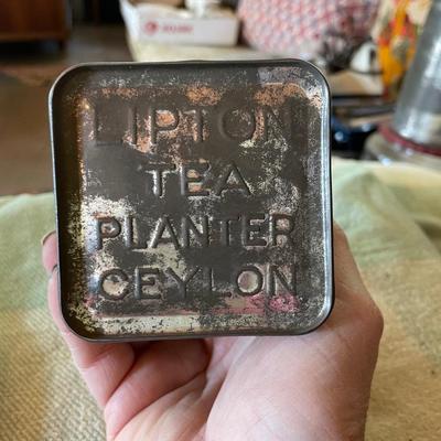 Lipton tea tin full of thread