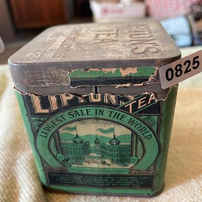Lipton tea tin full of thread