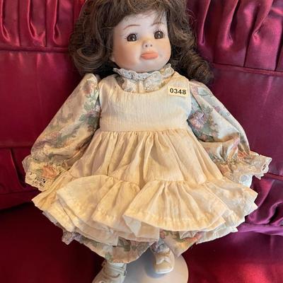 Sweet doll on stand
