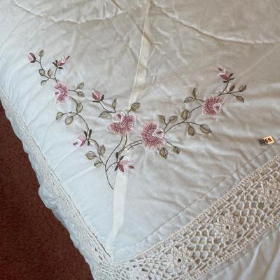 Bedding with floral in corner