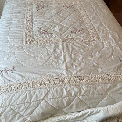 Bedding with floral in corner