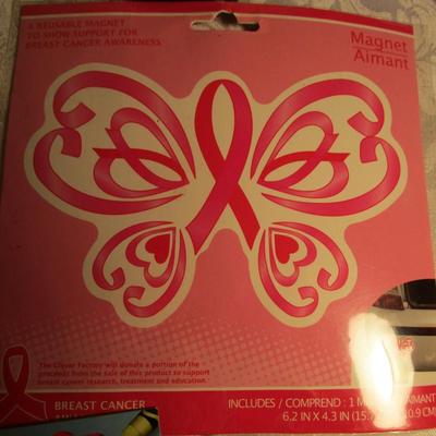 Small clock, retractable badge holders, 3-hole punch, key rings, magnets, crayons, stickers, coupon/recipe holder 3x5, 5 x 7 legal pad