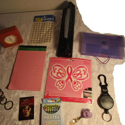 Small clock, retractable badge holders, 3-hole punch, key rings, magnets, crayons, stickers, coupon/recipe holder 3x5, 5 x 7 legal pad