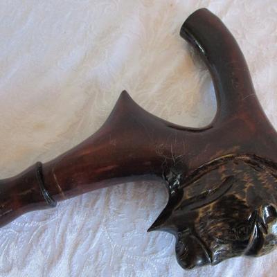 Wood carved buffalo head cane