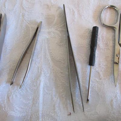 3 personal fans, emory boards, tweezers, shoe horn, extra large safety pin