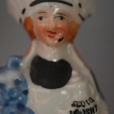 ANTIQUE PAIR OF CHARACTER PORCELAIN LIQUOR FLASKS