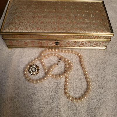 MUSICAL JEWELRY BOX, CAMEO BROOCH AND A FAUX BEADED NECKLACE