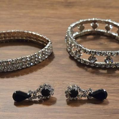 (2) Rhinestone Bracelets and a Pair of Earrings