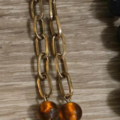(2) Beaded Necklaces- One Black Beads and the other Amber Colored Beads
